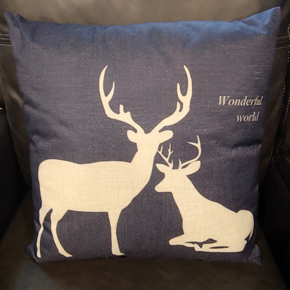 Two Elk print accent pillows